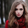 Young woman in red scarf in park. Perfect female face Royalty Free Stock Photo