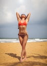 Young woman in red swimsuit and sunglasses