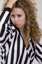 Young woman in referee striped shirt