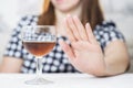 Young woman refused alcohol drink. Concept of alcoholism. Womans alcoholism Royalty Free Stock Photo