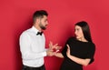 Young woman rejecting engagement ring from boyfriend on background