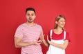 Young woman rejecting engagement ring from boyfriend on background Royalty Free Stock Photo