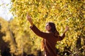 Young woman relaxing in autumn park. Royalty Free Stock Photo