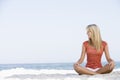 Young woman relaxing on beach Royalty Free Stock Photo