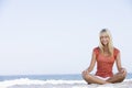 Young woman relaxing on beach Royalty Free Stock Photo