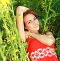 Young woman relaxing on a beautiful green meadow Royalty Free Stock Photo