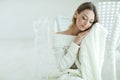 Young woman relaxing with chunky wool blanket. Relax, comfort lifestyle. Winter style. Royalty Free Stock Photo