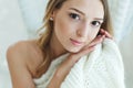 Young woman relaxing with chunky wool blanket. Relax, comfort lifestyle. Winter style. Royalty Free Stock Photo