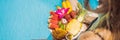 Young woman relaxing and eating fruit plate by the hotel pool. Exotic summer diet. Photo of legs with healthy food by Royalty Free Stock Photo