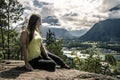 Young woman relaxing and enjoying the view on the fjord of Norway Royalty Free Stock Photo