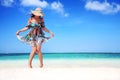 Young woman relaxing on exotic beach and enjoying the nice weather Royalty Free Stock Photo