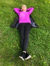 Young woman relaxing on green grass Royalty Free Stock Photo