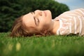 Young woman relaxing on green grass outdoors Royalty Free Stock Photo