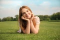 Young woman relaxing on green grass outdoors Royalty Free Stock Photo