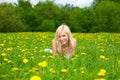 Young woman relaxing on a green meadow Royalty Free Stock Photo