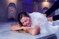 Young woman relaxing in hammam or turkish bath Royalty Free Stock Photo