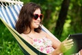 Young woman relaxing on hamock Royalty Free Stock Photo