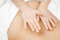Young woman relaxing with hand professional back massage beauty spa Royalty Free Stock Photo