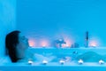 Young woman relaxing in hot foam bath.