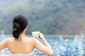 Young woman relaxing in hot springs