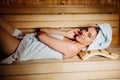 Young woman relaxing inside spa sauna room.Enjoying relaxing vacation day doing body treatment in luxury resort hotel.Beauty Royalty Free Stock Photo
