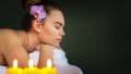 Young woman relaxing during massage therapy at luxury beauty spa Royalty Free Stock Photo