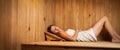 Young woman relaxing in a sauna Royalty Free Stock Photo