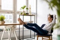 Young woman relaxing in office Royalty Free Stock Photo