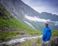 Young woman relaxing outdoor travel freedom lifestyle with mountains on background in Norway Royalty Free Stock Photo