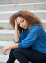 Young woman relaxing outdoors with hand in hair Royalty Free Stock Photo