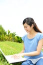 Smiling woman using a laptop Royalty Free Stock Photo