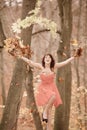 Young woman relaxing playing with leaves in autumn park Royalty Free Stock Photo