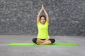 Young woman relaxing while practising yoga Royalty Free Stock Photo