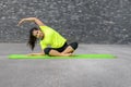 Young woman relaxing while practising yoga Royalty Free Stock Photo