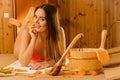 Young woman relaxing in sauna. Spa wellbeing. Royalty Free Stock Photo