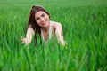 Young woman relaxing and smiling in fresh green fi Royalty Free Stock Photo