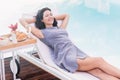 Young woman relaxing on a sun lounger Royalty Free Stock Photo