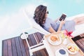 Young woman relaxing on a sun lounger near poolside Royalty Free Stock Photo