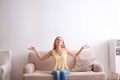 Young woman relaxing under air conditioner Royalty Free Stock Photo