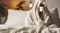 A Young Woman Relishing Her Morning Coffee, Wrapped in a Blanket on Her Bed at Home