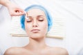 Young woman remove hair from her eyebrows Royalty Free Stock Photo