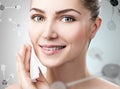 Young woman remove makeup among molecules Royalty Free Stock Photo