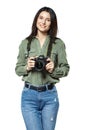 Female photographer reporter in jeans and a khaki shirt posing with a camera. Isolated on white