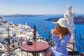 Young woman in a restaurant over the sea Royalty Free Stock Photo