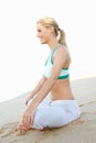 Young Woman Resting After Exercise On Beach Royalty Free Stock Photo