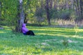 Young woman resting in the forest