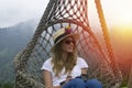 A young woman resting in a hammock in Pokut Plateau