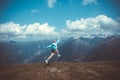 Young woman resting on a mountain hike