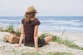 Young woman resting by the sea. Girl lying down on the beach. Enjoying life, summer lifestyle, relaxation and travel concept