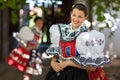 young woman in a richly decorated ceremonial folk dress